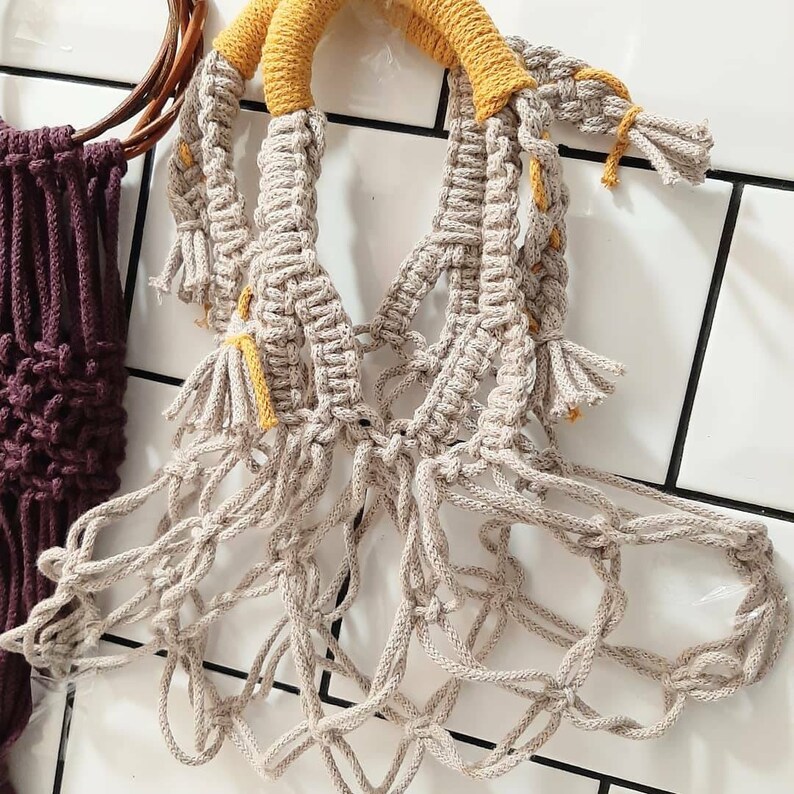 Handcrafted from recycled cotton with a comfortable handle. pretty macram\u00e9 handbag perfect for carrying your favourite books Unique