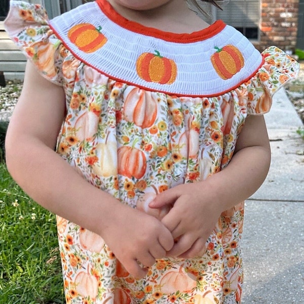 Adorable Baby Girl and Toddler Girls Smocked Pumpkin Fall Dress Adorned with Pumpkin Smocked Bodice.