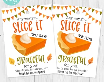 May include: Two white gift tags with a pumpkin pie slice graphic and text that reads "Any way you slice it, we are grateful for you!" with fall leaf accents. The tags are decorated with orange, green, and yellow bunting.