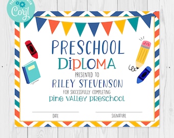 May include: A printable preschool diploma certificate with a colorful border and illustrations of a book, crayon, and pencil. The text reads "Preschool Diploma" and "Presented to Riley Stevenson for successfully completing Pine Valley Preschool".
