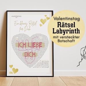 May include: A framed print with a heart-shaped maze design. The words "ICH LIEBE DICH" are visible within the maze. The print also includes the text "Valentinstag" and "Ein kleines Rätsel für Dich."