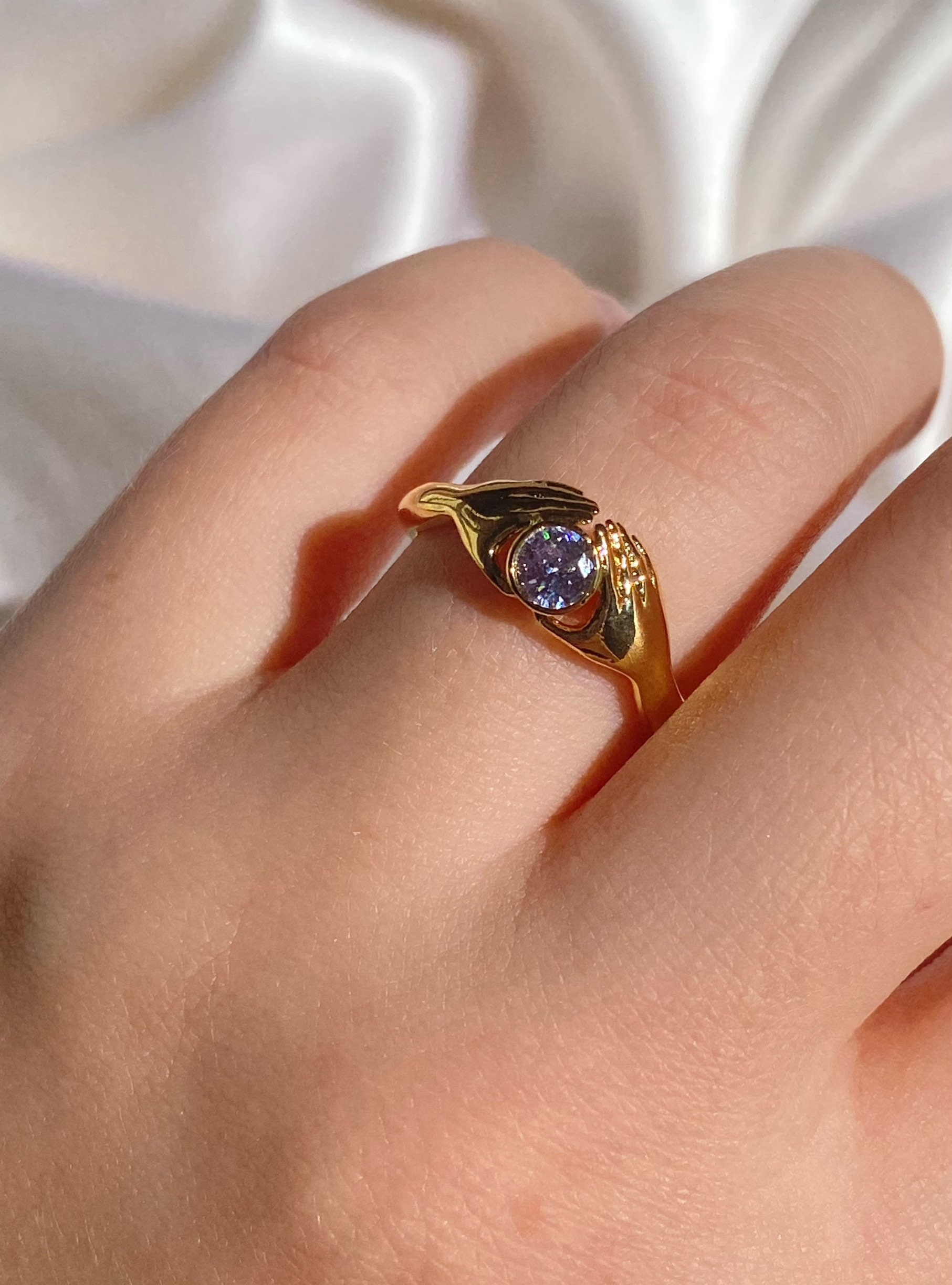 Gold ring with hand sale