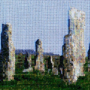 May include: A cross-stitch pattern of the Callanish Stones, a prehistoric stone circle in Scotland. The image shows a group of tall, grey stones standing in a field.