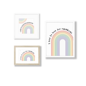 May include: Three framed prints with a rainbow design and the text "I like to look for rainbows". The prints are in white, light brown, and dark brown frames.