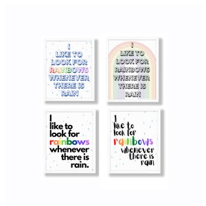 May include: Four white framed prints with a rainbow design and the text "I like to look for rainbows whenever there is rain." The text is in black and the background is white with a light blue raindrop pattern.