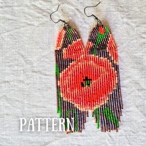May include: A pair of long, rectangular beaded earrings featuring a vibrant floral pattern. The design displays a large central orange-red flower with green leaves against a dark grey background, crafted from small seed beads with silver-tone hooks.