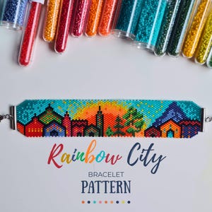 May include: A beaded bracelet featuring a colorful city skyline at sunset with a bright orange sun, green trees, and multi-colored buildings. Above the bracelet are clear tubes filled with various colored seed beads. Text reads Rainbow City BRACELET PATTERN.