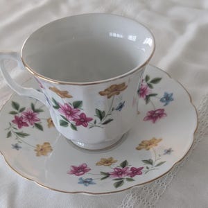 Floral Tea Cup and Saucer Set - Pink, Blue, and Yellow Flowers