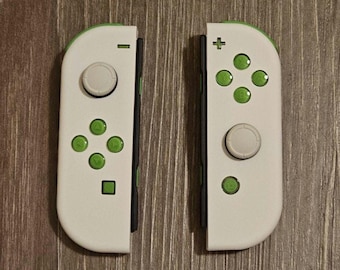 Joy-cons personalizados en color blanco con botones de gelatina verde