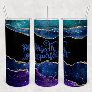 May include: Three stainless steel tumblers with a galaxy-inspired design. The tumblers feature a blue, purple and teal agate pattern with gold glitter accents. The text "Perfectly Imperfect" is written in blue on the middle tumbler.