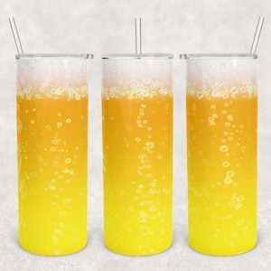 May include: Three tall, clear tumblers with yellow and white ombre designs. The tumblers have a bubbly effect, resembling a fizzy drink. Each tumbler has a clear straw.