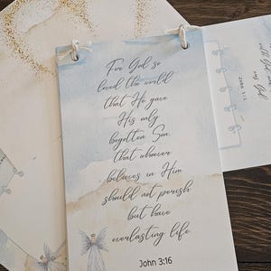 May include: A watercolor-style card with the text "For God so loved the world that He gave His only begotten Son, that whoever believes in Him should not perish but have everlasting life. John 3:16." An angel illustration is at the bottom.