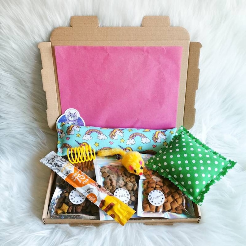 A cat gift box which contains treats and handmade strong smelling catnip toys which cats will love