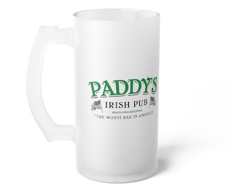 May include: White frosted glass beer stein with a green logo that reads "Paddy's Irish Pub South Philadelphia "The Worst Bar in America".