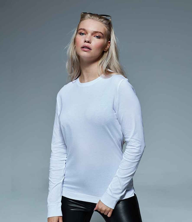 May include: A white long-sleeved t-shirt with a crew neck.