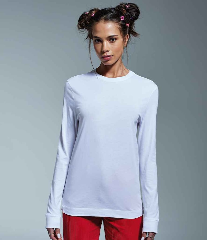 May include: A white long-sleeved t-shirt with a crew neck.
