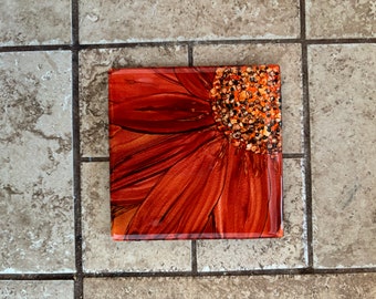 Orange flower drink coaster, hand painted with alcohol inks on 4-1/4 inch ceramic tile