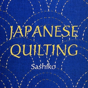 May include: A book cover with the title "Japanese Quilting Sashiko" by Hiromitsu Takano. The cover is a blue fabric with a white stitching pattern.