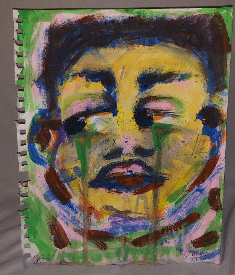 May include: Abstract painting of a person's face with green, blue, yellow, pink, and brown paint. The person's eyes are closed and they appear to be crying. The painting is signed "GROW UP" in the bottom right corner.