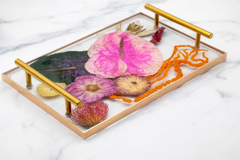 Tropical bouquet preserved in resin serving tray with gold handles and gold painted edge