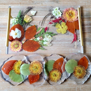 Orange leaves and yellow flowers preserved in epoxy resin tray and coaster set