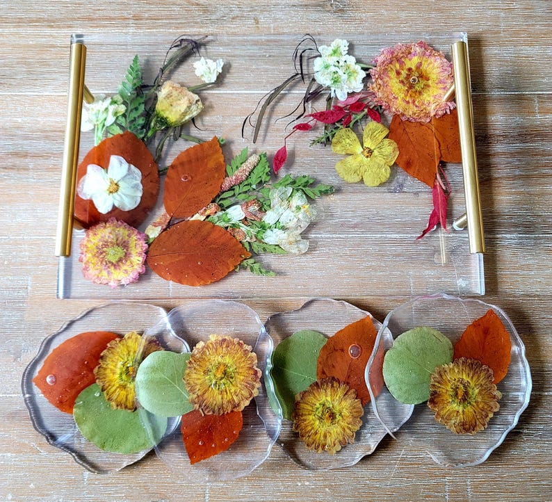 Orange leaves and yellow flowers preserved in epoxy resin tray and coaster set