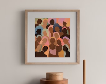 May include: A framed art print featuring a diverse group of people with varying skin tones and hair colors. The artwork has a soft, pastel color palette with shades of pink, orange, blue, and brown. The print is displayed on a wooden cabinet with decorative boxes.