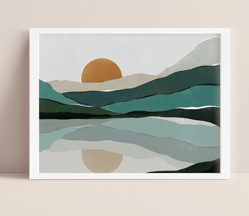 May include: A digital art print of a landscape with a large orange sun setting behind a series of teal and green mountains reflected in a still lake.