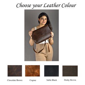 May include: A woman is holding a brown leather satchel bag. The bag has a flap closure and a long strap. The image shows four different leather colors: Chocolate Brown, Cognac, Sable Black, and Dusky Brown.