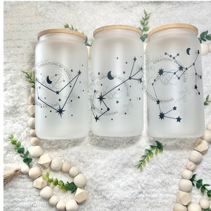 May include: Three frosted glass jars with bamboo lids, each featuring a constellation design with a crescent moon and stars. The jars are labelled "CREATIONS BY KRISTA LEE" and "SUBLIMATION DESIGNS".