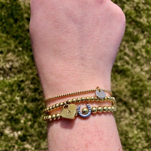 Dainty bracelet with customizable initial charm