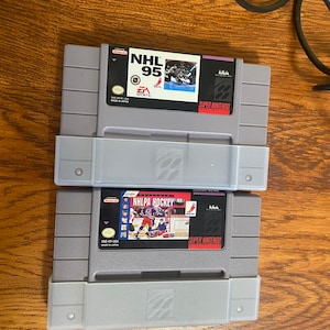 Super Nintendo hockey game cartridges: NHL 95 and NHLPA Hockey 93