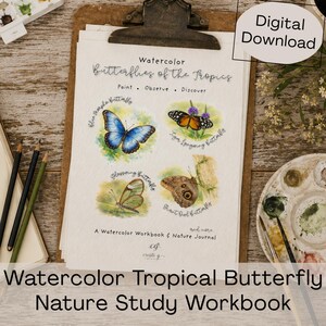 May include: A watercolour workbook titled "Butterflies of the Tropics" with illustrations of butterflies. The workbook includes the text "Paint, Observe, Discover" and is a "Digital Download". Pencils and a watercolour palette are also visible.