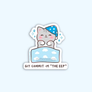 May include: A sticker featuring a cartoon cat wearing a blue polka-dot sleep cap, nestled in a blue bed with cloud designs. The sticker has the text "GIT COMMIT -M 'THE EEP'" and the brand name "bakadreams".