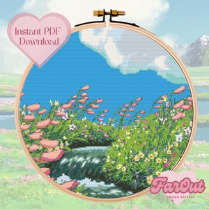 May include: Cross stitch pattern of a whimsical landscape with a waterfall, flowers, and a blue sky. The pattern is displayed in a wooden embroidery hoop. The text "FarOut Cross Stitch" is visible in the lower right corner.