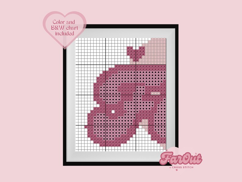 Op de afbeelding: Een kruissteekpatroon van een roze hart met een klein hartje bovenop. Het patroon is in een zwart frame met de tekst "FarOut Cross Stitch" onderaan.