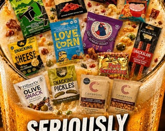 May include: A collection of various snack pouches including beef biltong, pork crackling, cheese, corn, pickles, and nuts arranged over a large glass of beer. The image features text including The Dandy Snack Club, Seriously Good Snacks, and DandySnacks.com.