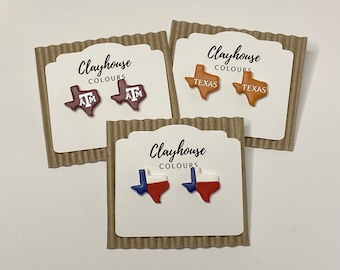May include: Three cards with the text "Clayhouse Colours" and different Texas-themed designs. The first card has a maroon Texas outline with the letters "A" and "M" in white. The second card has an orange Texas outline with the word "Texas" in white. The third card has a Texas outline with the colors of the Texas flag.