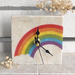 Handmade clock made of marble tile with a rainbow motif, including wooden stand