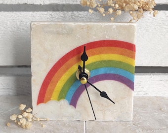 Handmade clock made of marble tile with a rainbow motif, including wooden stand