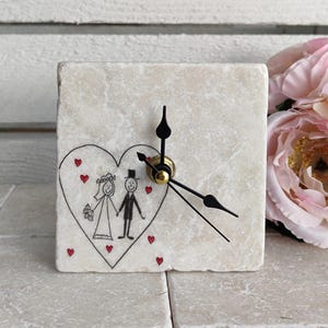 Handmade marble tile clock with wedding motif, including wooden stand