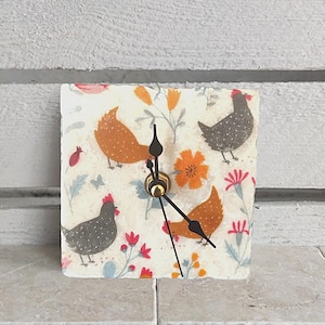 Clock made of marble tile including wooden stand, small table clock, shelf clock, with Chicken motiv