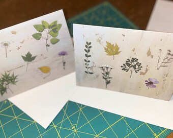 Two blank cards with pressed leaf and flower images