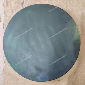 May include: A round, dark green, glass plate with a slightly textured surface. The plate has a website address printed on it: www.etsy.com/shop/indianArtistArt.
