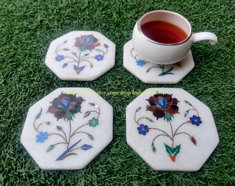 Juego de 4 posavasos de mármol con incrustaciones de rosas y piedras semipreciosas