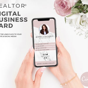 May include: A digital business card template for a realtor. The card features a pink and white marble background with a photo of a woman in a circle. The card includes the realtor's name, contact information, website, and social media links. The text "REALTOR&reg;" is at the top of the card. The text "DIGITAL BUSINESS CARD" is below the realtor's name. The text "MAKE THE LINKS CLICK TO YOUR WEBSITE & SOCIAL MEDIA!" is below the card. The card is being held by a person's hand. The text "EDIT IN Canva STUDIOMIA.COM" is at the bottom of the image.