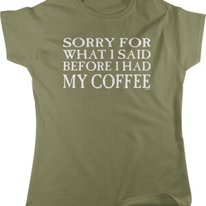 May include: A green t-shirt with the text "SORRY FOR WHAT I SAID BEFORE I HAD MY COFFEE" printed in white.