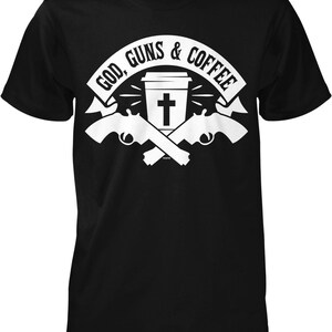 May include: Black t-shirt with a white graphic design. The graphic features a coffee cup with a cross on it, two crossed pistols, and the text "God, Guns & Coffee".