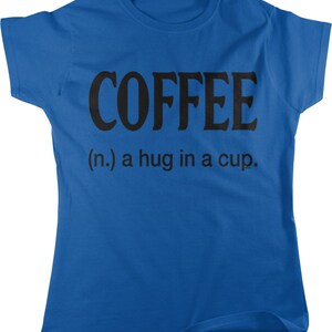 May include: A royal blue t-shirt with black text that reads "COFFEE (n.) a hug in a cup."
