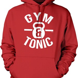 May include: Red hooded sweatshirt with white text that reads "GYM TONIC" with a white kettlebell graphic in the center.
